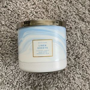 Linen sheets candle